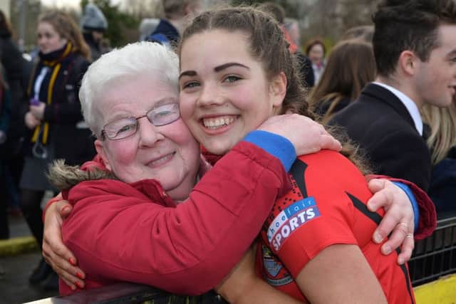 Defender Ellen Reid receives a big hug from grandmother Hazel after a top performance.