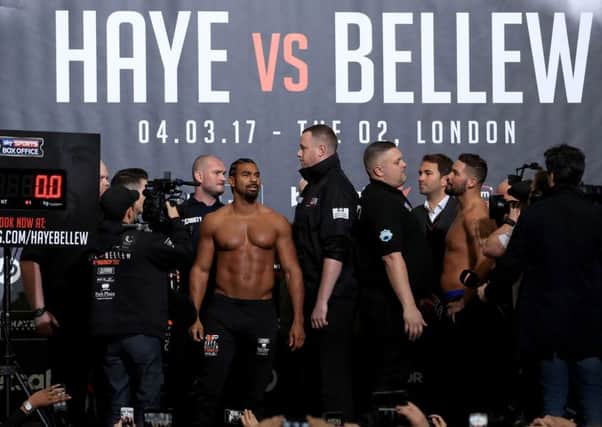 David Haye (centre) and Tony Bellew (right) during the weigh-in at The O2