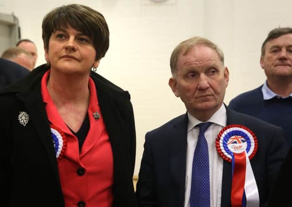 DUP party chairman Lord Morrow (right) with DUP leader Arlene Foster at Omagh count centre. Photo: Brian Lawless/PA Wire