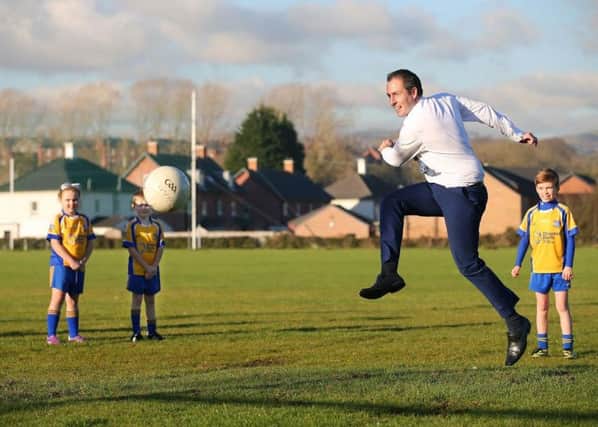 Weeks after this wonderful image of Paul Givan playing GAA in Lisburn, he squandered the goodwill by axing an Irish language bursary. Â Photo by Kelvin Boyes / Press Eye.