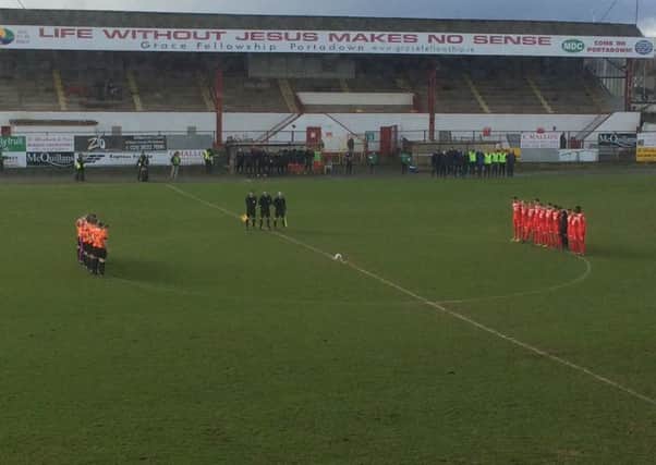 Glenavon and Portadown join for a minute's silence before this afternoon's match.