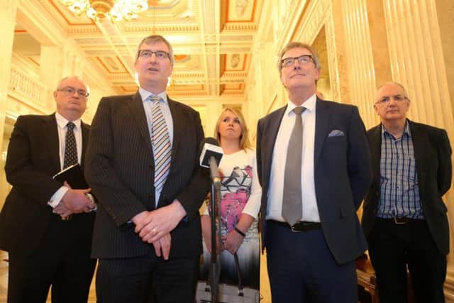 Tom Elliott (front left), next to now-resigned party leader Mike Nesbitt (front right), stand at the head of a UUP group at Parliament Buildings. Mr Elliott has said that it is too early to say if the Ulster Unionists could re-enter any Executive, after having left to head up a bloc of opposition parties last year