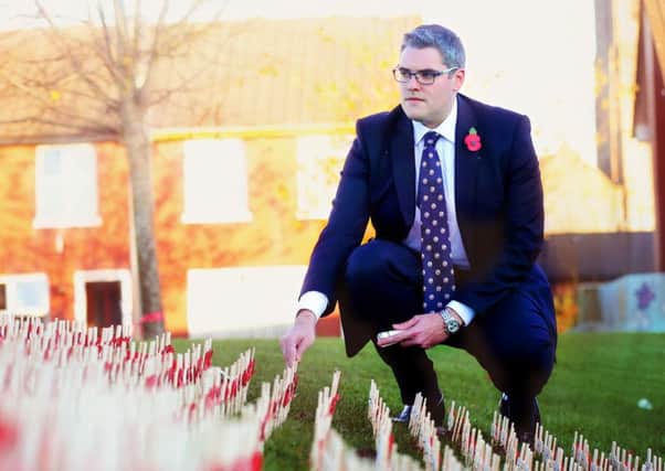 DUP MP Gavin Robinson at a memorial to fallen solders in Pitt Park on the Newtownards Road in east Belfast