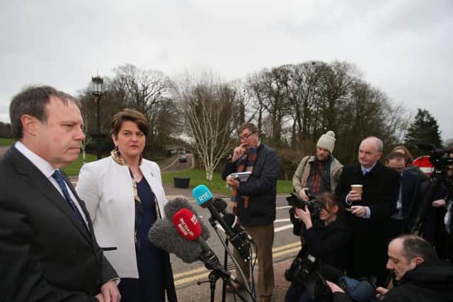 DUP leader Arlene Foster and deputy leader Nigel Dodds speaking to the media outside Stormont in Belfast.