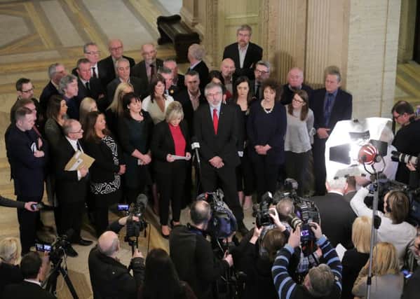 Gerry Adams with the Sinn Fein team at Stormont yesterday. Photo by Kelvin Boyes / Press Eye