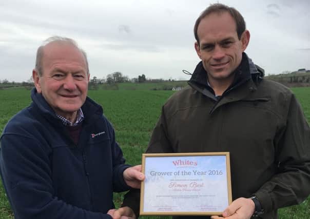 Raymond Hilman, Whites agronomist, presents Simon Best with his award for Whites Grower of the Year 2016