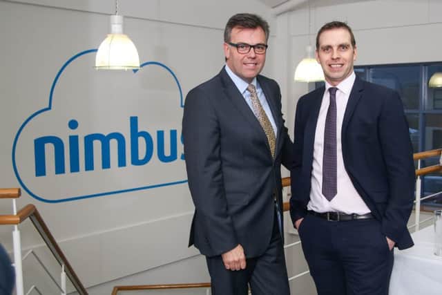 Nimbus founder Gareth McAlister pictured with Invest NI chief executive Alastair Hamilton at the opening of the firms new Belfast offices
