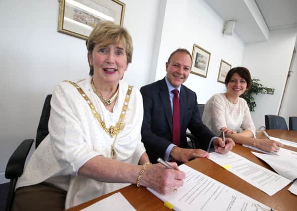 Pictured at the contracting signing of Northern Ireland's first Enterprise Zone which will be located in Coleraine are the Mayor of Causeway Coast and Glens Borough Council, Alderman Maura Hickey with Karise Hutchinson from Ulster University and Paul Beazley, from 5nines, the anchor tenant on the site