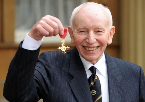 John Surtees pictured after he was awarded an OBE by Queen Elizabeth II at Buckingham Palace in 2009.