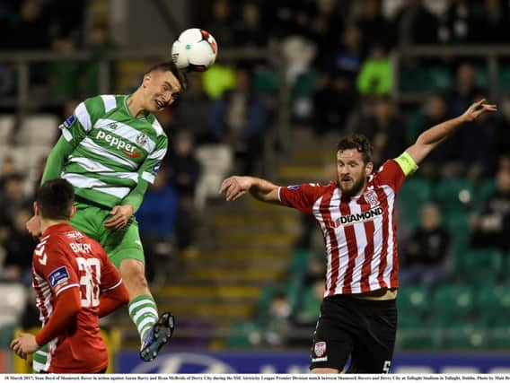 Sean Boyd of Shamrock Rovers in action against Aaron Barry and Ryan McBride of Derry City during the SSE Airtricity League Premier Division match between Shamrock Rovers and Derry City at Tallaght Stadium.