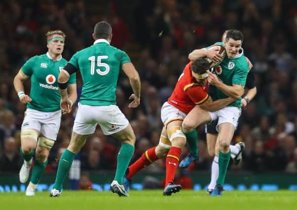 Ireland's Jonathan Sexton is tackled