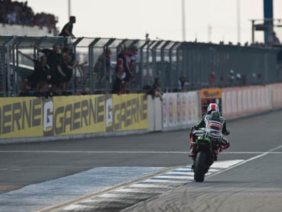 Jonathan Rea powers towards the finishing line in race one in Thailand on Saturday.