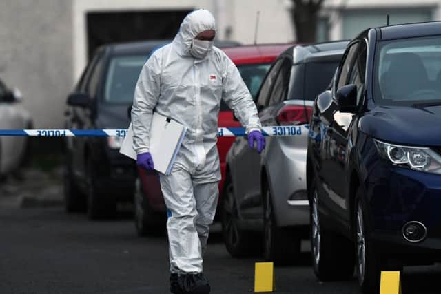 Police forensics at the scene after a shooting incident in the Pinewood Avenue area of Carrickfergus