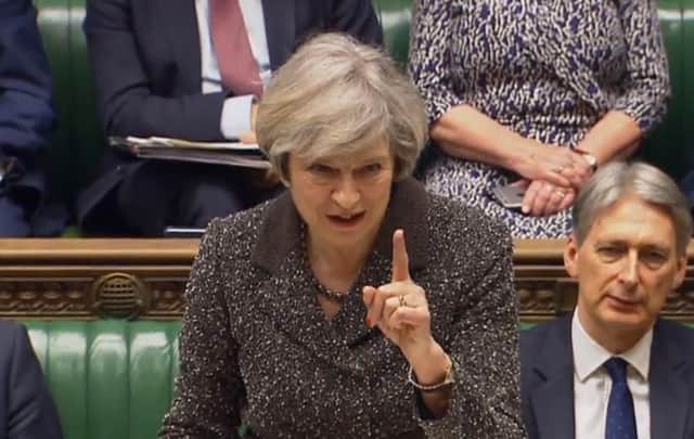 Prime Minister Theresa May makes a point in the House of Commons on Tuesday