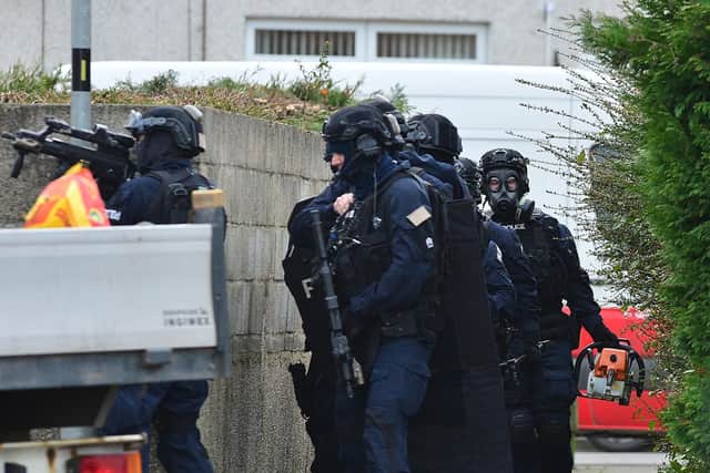 PSNI officers carry out armed raid after Carrickfergus shooting yesterday