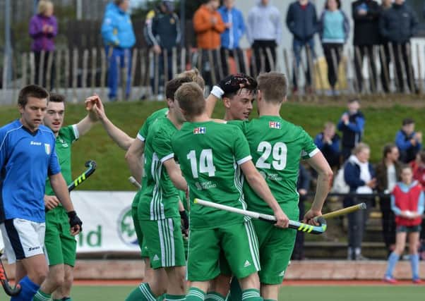 Ireland's Matthew Nelson is congratulated after scoring against Italy