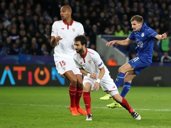 Leicester's Marc Albrighton, right, makes it 2-0 as the Foxes beat Sevilla 3-2 on aggregate to reach the Champions League quarter finals