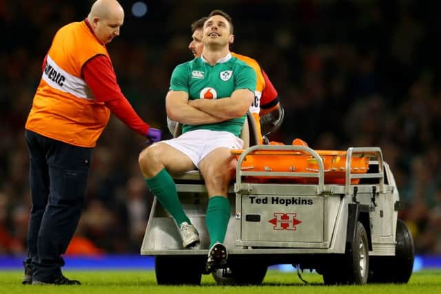Ireland's Tommy Bowe leaves the field injured
 against Wales
