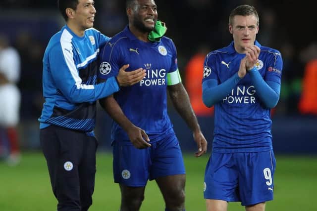 Wes Morgan, centre, opened the scoring at a raucous King Power Stadium