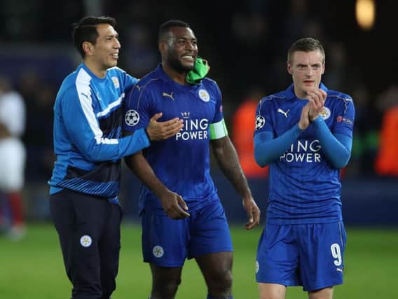 Wes Morgan, centre, opened the scoring at a raucous King Power Stadium