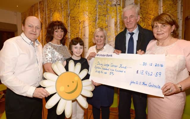 Agricultural contractor, John Dan O'Hare and his wife Bernadette from Annaclone, make a cheque presentation of Â£18,,962.59 pence to Cancer Fund for Children representative, Joan Burden, Hospitality Manager, Daisy Lodge, Bryansford. The proceeds were raised from a Open Day held at his Farm Complex in early January 2017. Also included are Sean Wallace, Country Music promoter, his wife Stefanie and daughter Emily a former resident of Daisy Lodge. Â© Photo: Gary Gardiner. WK11-006GG.
