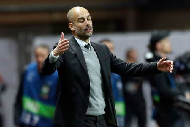 Manchester City's manager Pep Guardiola reacts as his watches his players during the Champions League round of 16 second leg soccer match between Monaco and Manchester City at the Louis II stadium in Monaco, Wednesday March 15, 2017. (AP Photo/Claude Paris)