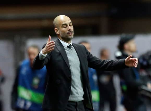 Manchester City's manager Pep Guardiola reacts as his watches his players during the Champions League round of 16 second leg soccer match between Monaco and Manchester City at the Louis II stadium in Monaco, Wednesday March 15, 2017. (AP Photo/Claude Paris)