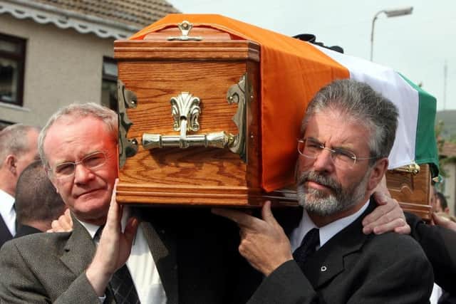 Sinn Fein's Martin McGuinness  and party president Gerry Adams and carrying the coffin of former senior IRA commander Brian Keenan in west Belfast in 2008. Photo: Paul Faith/PA Wire