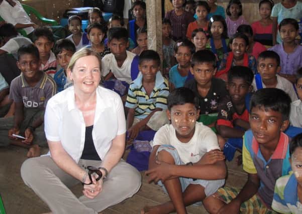 Rosamund Bennett pictured with children at an informal school in a Muslim camp in Myanmar