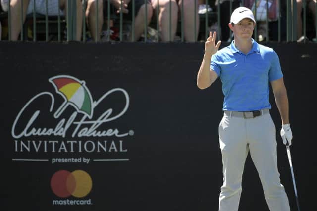Rory McIlroy acknowledges the crowd before teeing off on the first hole during the final round of the Arnold Palmer Invitational golf tournament in Orlando