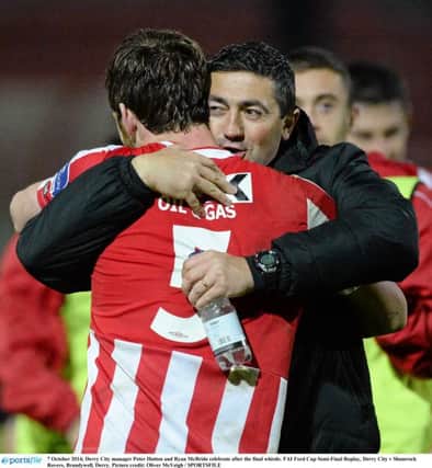 Derry City manager Peter Hutton and Ryan McBride embrace after victory over Shamrock Rovers in the FAI Cup semi-final replay in 2014.