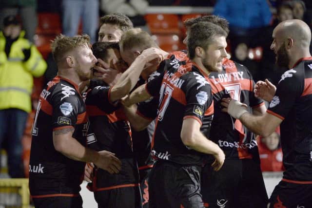 Crusaders Paul Heatley celebrates after he fires his team into a 2-1 lead