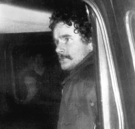 Martin McGuinness, sporting black hair and a moustache, after being arrested in Co Donegal in the early 1970s