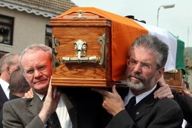Sinn Fein President Gerry Adams (right) and Martin McGuinness carrying the coffin of former senior IRA commander Brian Keenan in west Belfast in 2008. Photo: Paul Faith/PA Wire