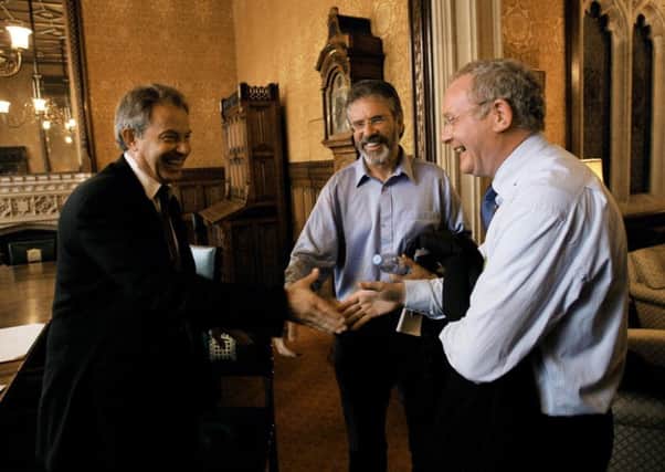 British prime minister Tony Blair meeting Gerry Adams (centre) and Martin McGuinness (right) in his office at the House of Commons, London in 2007.