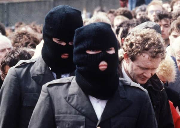 August 1985: Funeral of IRA man Chuck English. Pictured, right, is Martin McGuinness