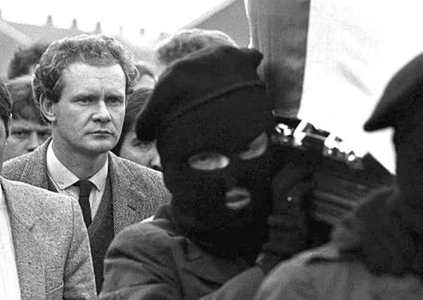 Martin McGuinness (left) follows the coffin of IRA man Charles English in Londonderry in 1984 PACEMAKER BELFAST