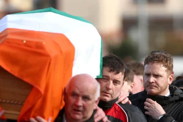 The sons of Northern Ireland's former deputy first minister and ex-IRA commander Martin McGuinness , Fiachra (left) and Emmet, carry his coffin to his home in Londonderry after he died aged 66.