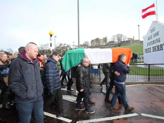 The remains of Martin McGuinness being carried home