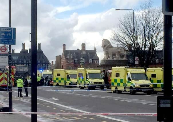 Ambulances on Westminster Bridge, London after policeman has been stabbed and his apparent attacker shot by officers in a major security incident at the Houses of Parliament.