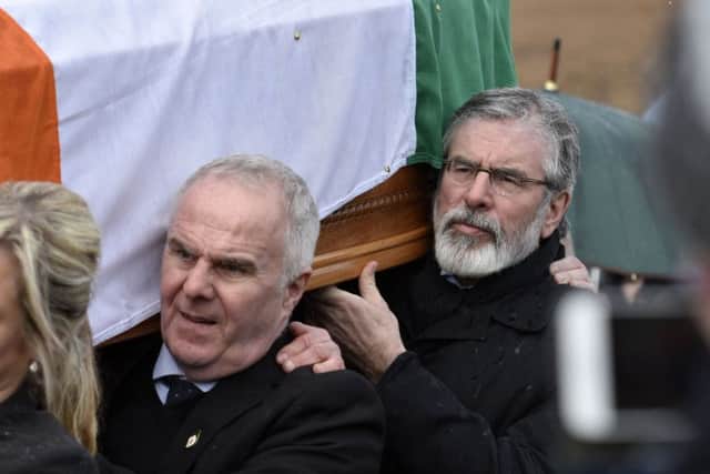 Gerry Adams carries the coffin of Martin McGuinness.