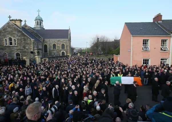 The coffin of Northern Ireland's former deputy first minister and ex-IRA commander Martin McGuinness leaves St Columba's Church Long Tower, in Londonderry, following his funeral service