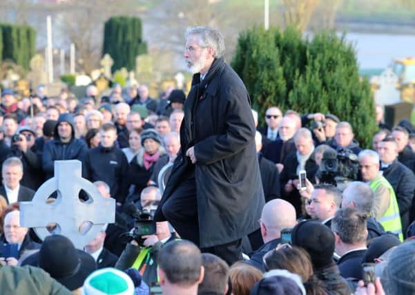 Gerry Adams steps up to speak at Derry City Cemetery, in Londonderry, after the funeral service of Northern Ireland's former deputy first minister and ex-IRA commander Martin McGuinness. PRESS ASSOCIATION Photo. Picture date: Thursday March 23, 2017. See PA story FUNERAL McGuinness. Photo credit should read: Niall Carson/PA Wire