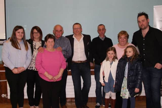 The Clarke family with charity representatives at the event in the former Lisnaskea High School. From left: Kirstys sister Zara Clarke, relative Joanne Amy Graham, Heartbeat NI representatives Carol and Irwin McKibbon, relative Thomas Graham, Kirstys father Alan Clarke, mother Sharon Clarke and SEFF director Kenny Donaldson