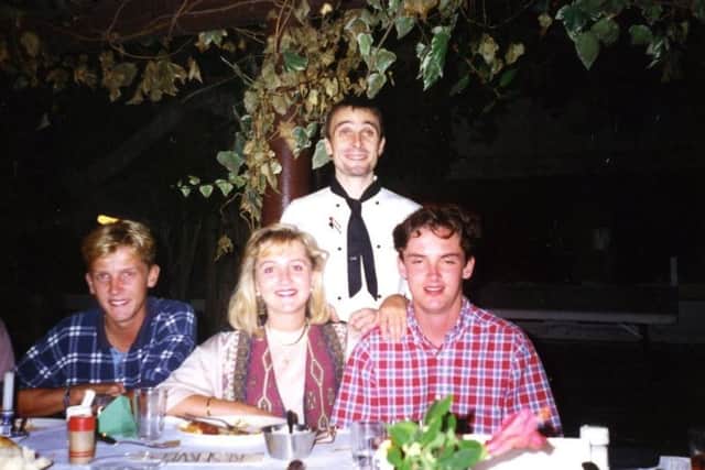 Colin as a chef in Beit Immanuel, Jaffa, Israel serving food outdoors to his three cousins from Norfolk.