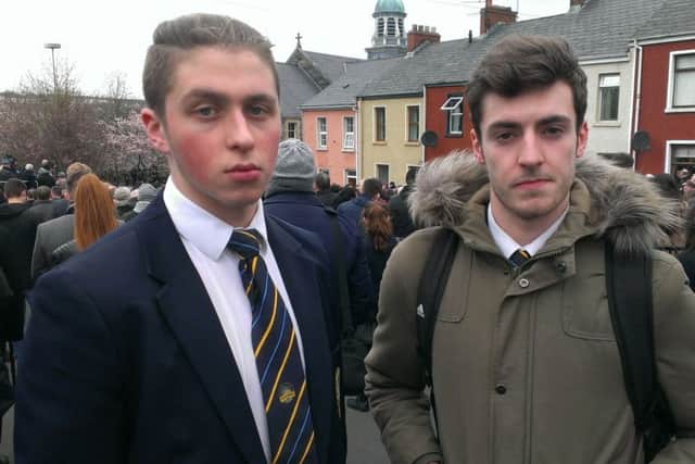 Conor Edwards and Leo Deehan, both 18 and both from Lumen Christi grammar school, outside St Columba's church in Londonderry during the funeral service for Martin McGuinness. March 23 2017 By Ben Lowry