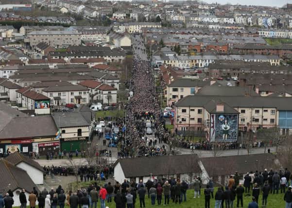 The coffin of Northern Ireland's former deputy first minister and ex-IRA commander Martin McGuinness is carried down Westland Street into the Bogside ahead of his funeral at St Columba's Church Long Tower, in Londonderry. Photo: Chris Radburn/PA Wire