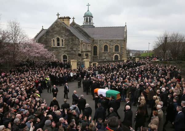 The coffin of Northern Ireland's former deputy first minister and ex-IRA commander Martin McGuinness is carried up Barrack Street ahead of his funeral at St Columba's Church Long Tower, in Londonderry. Photo: Brian Lawless/PA Wire