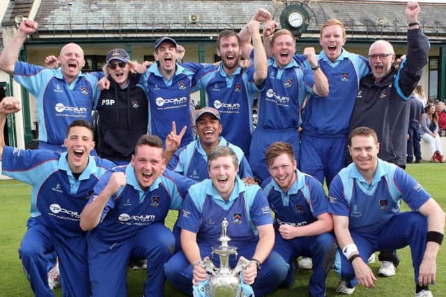 Getkate celebrates with his CSNI team-mates after last year's Challenge Cup final triumph over CIYMS