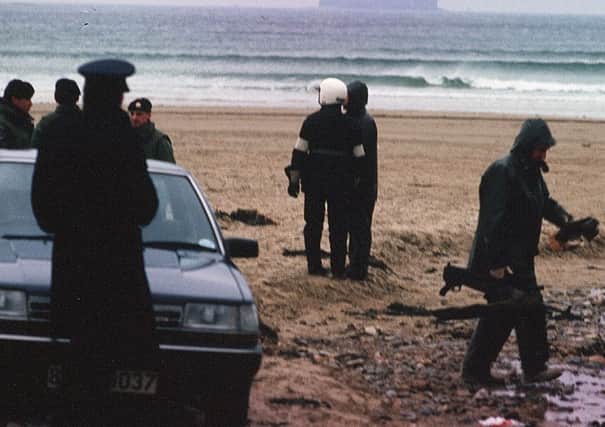 Garda officers uncover a cache of Libyan weapons bound for the IRA on Five Fingers beach, Co Donegal in 1988